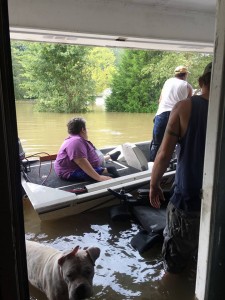 Allen in the boat - you can see his usual wheelchair in the water next to it